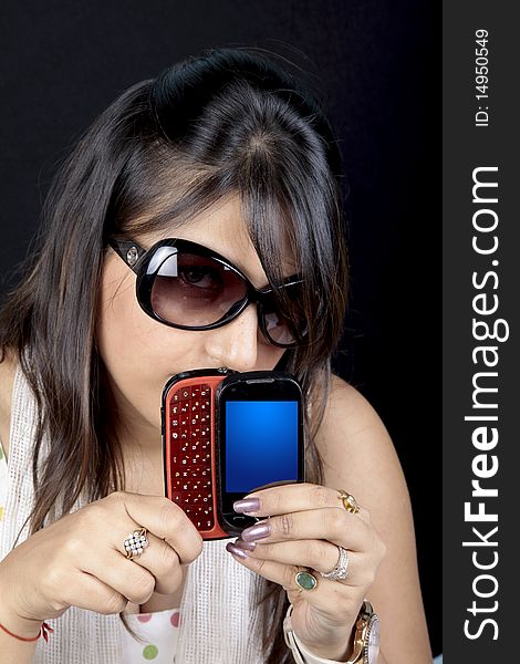 Girl showing multimedia phone in her hand. Girl showing multimedia phone in her hand.