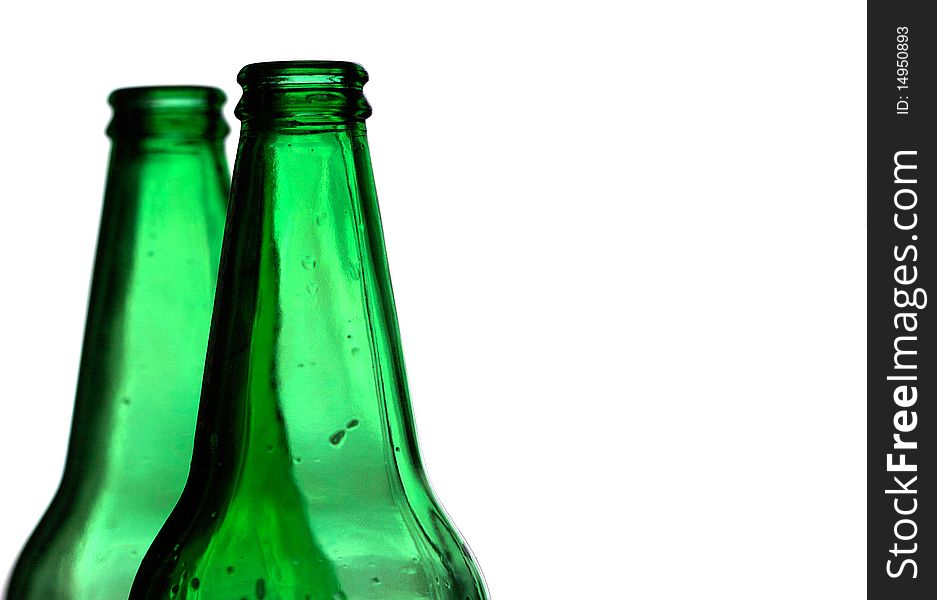 Two green bottles on a white background. Two green bottles on a white background.