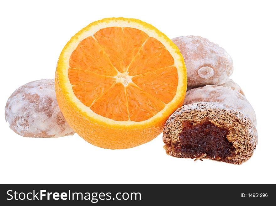 Easy dessert - sweet spice-cakes and an orange on a white background.