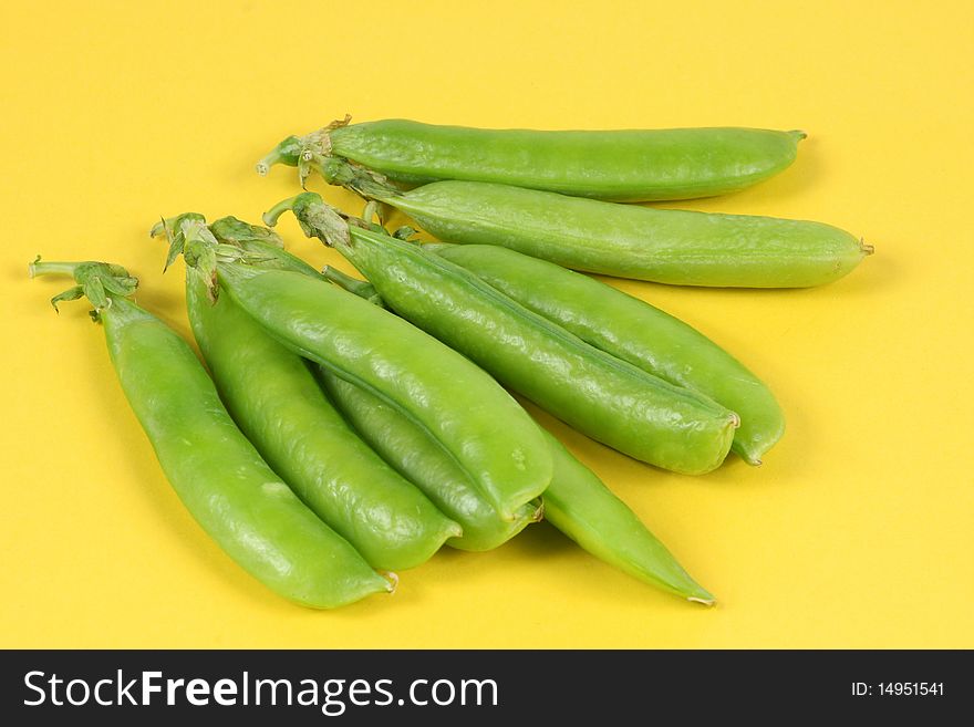 Green Pea on the yellow background