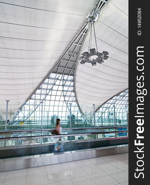 Modern interior airport with a moving passenger