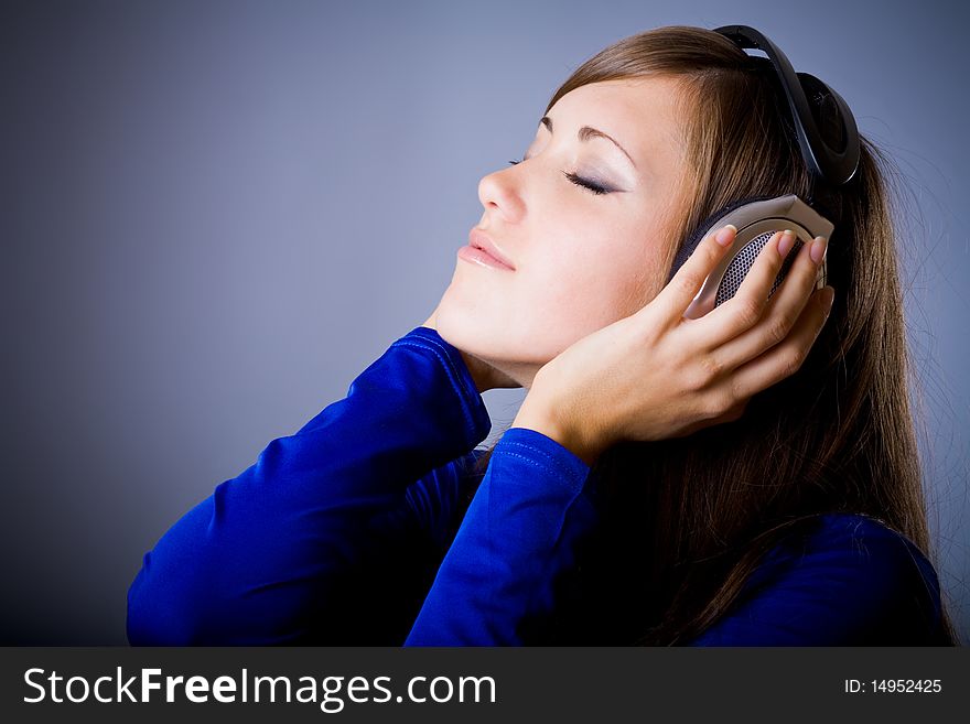 Beautiful Headphones Girl on blue background