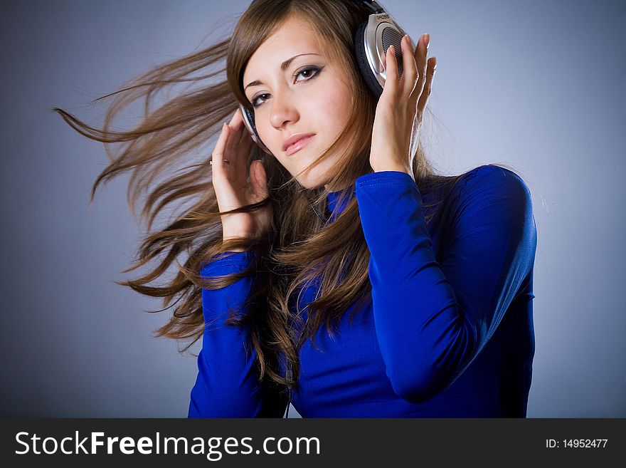 Beautiful Headphones Girl on blue background