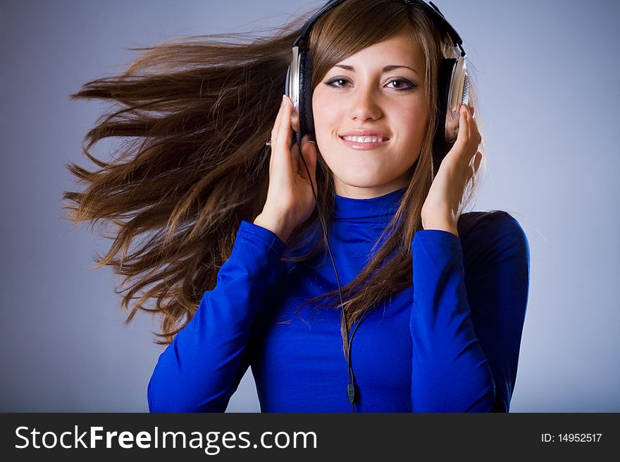 Beautiful Headphones Girl on blue background