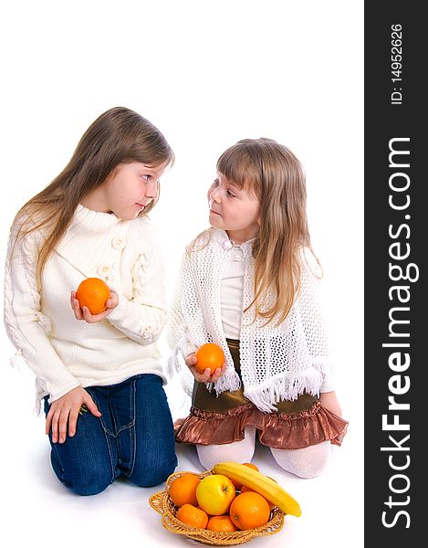 Two Little Girls With Fruit On White