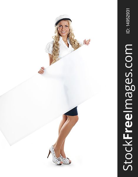 A young and cute sailor girl in a white coat is holding a large blank poster. The image is isolated on a white background. A young and cute sailor girl in a white coat is holding a large blank poster. The image is isolated on a white background.