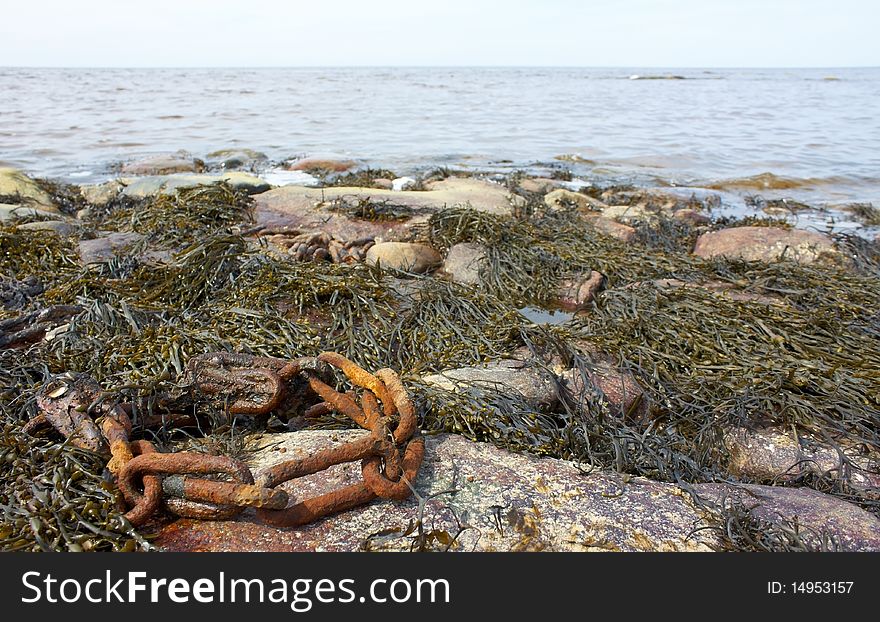 Rusty chain on the White Sea coast. . Rusty chain on the White Sea coast.