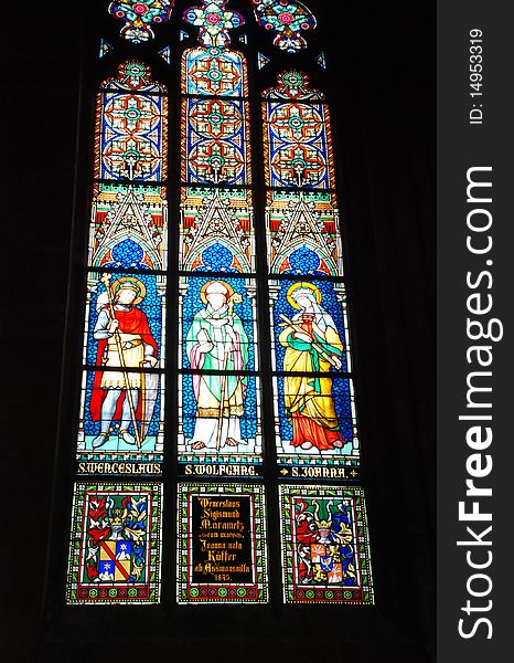 Gothic stained glass window in St. Vitus cathedral in Prague portraying the Pentecost