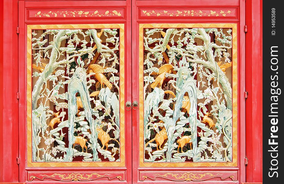 Full frame Chinese style wooden red door as cage, Ayutthaya Thailand.