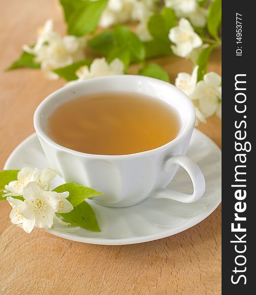 Organic jasmine tea with fresh jasmine flowers. Organic jasmine tea with fresh jasmine flowers.