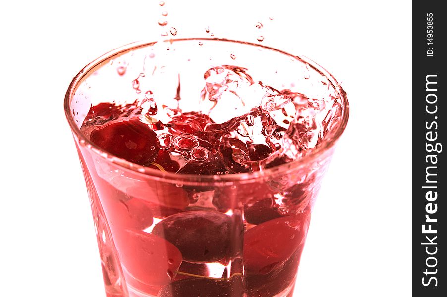 ripe juicy cherries in glass with pure fresh water. ripe juicy cherries in glass with pure fresh water