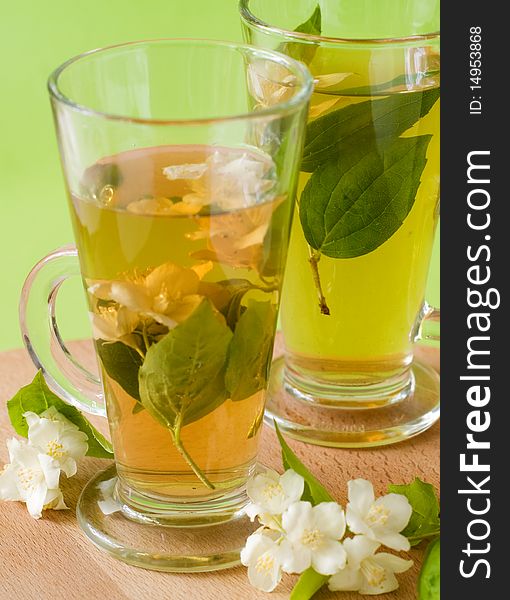 Organic jasmine tea with fresh jasmine flowers. Organic jasmine tea with fresh jasmine flowers.