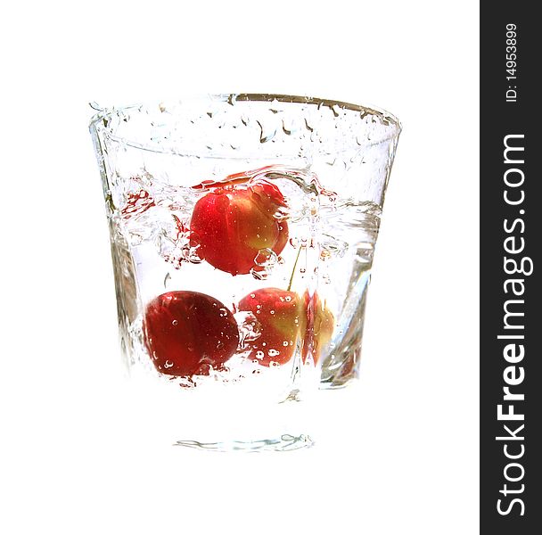 Ripe juicy cherries in glass with pure fresh water. Ripe juicy cherries in glass with pure fresh water