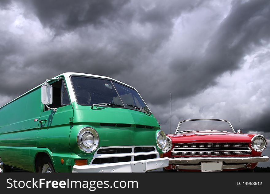 Classic van and car against cloudy sky background. Classic van and car against cloudy sky background