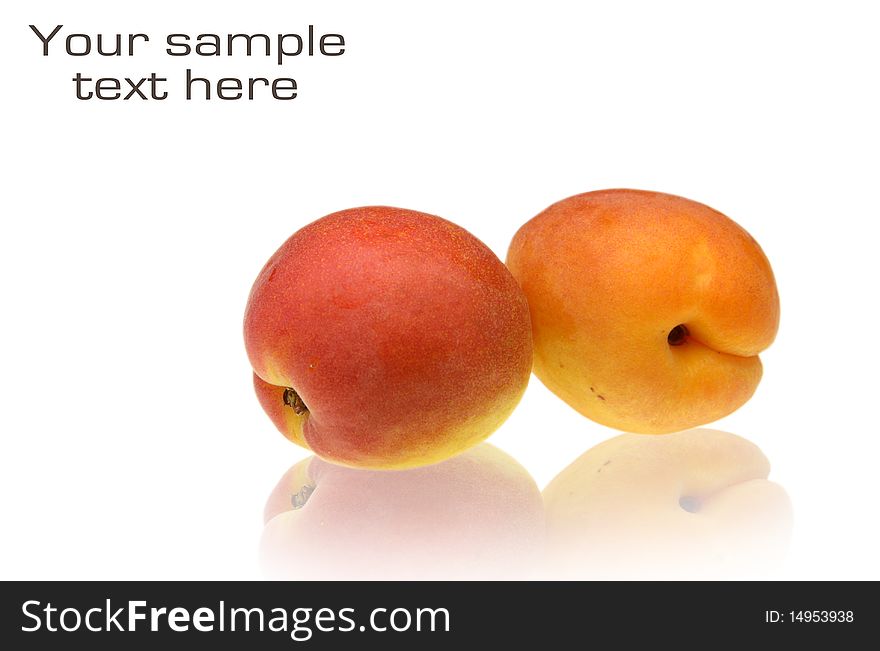Two fresh peach fruits isolated on white background