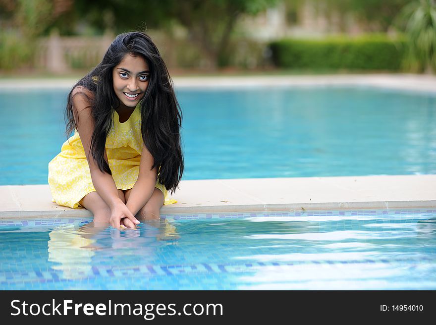 Girl Sitting At Pool
