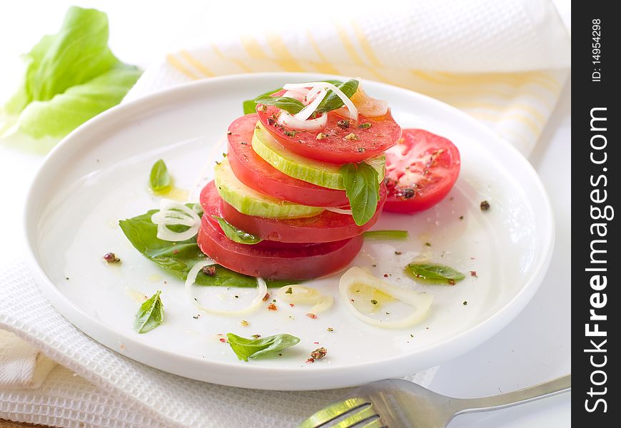 Snack from tomatoes and zuccini with olive oil. Snack from tomatoes and zuccini with olive oil