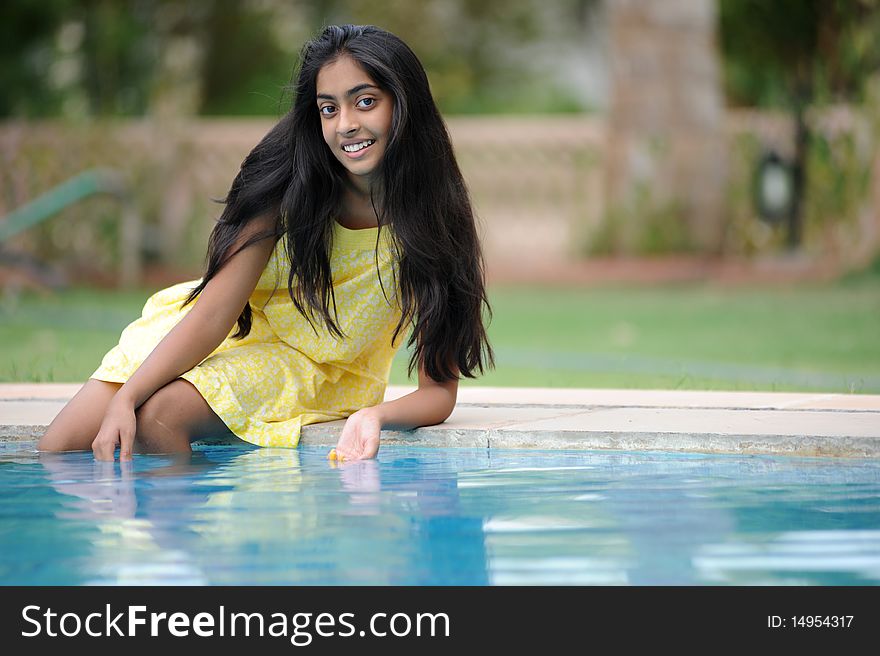 Girl Sitting At Pool