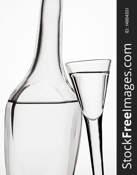 Bottle and wine-glass on a white background