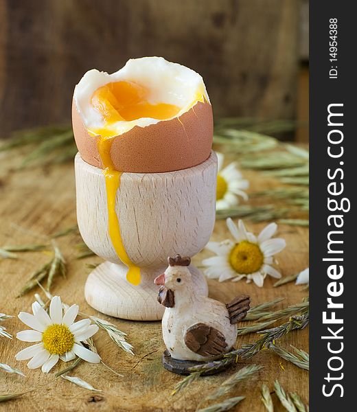 Soft boiled egg in wooden eggcup