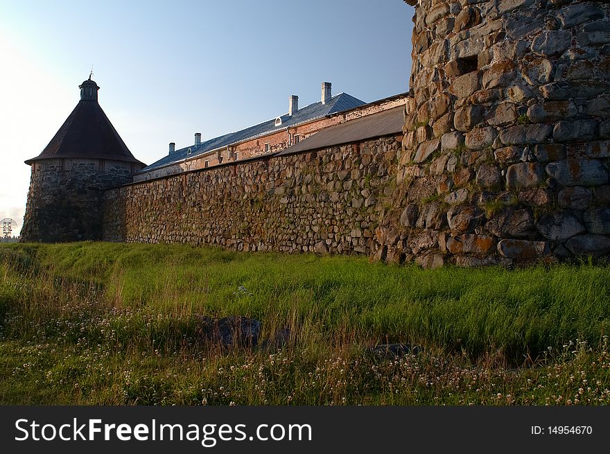 Old round stone tower in Solovetsky monastery with blue sky background, Karelia, Russian Federation. Old round stone tower in Solovetsky monastery with blue sky background, Karelia, Russian Federation.