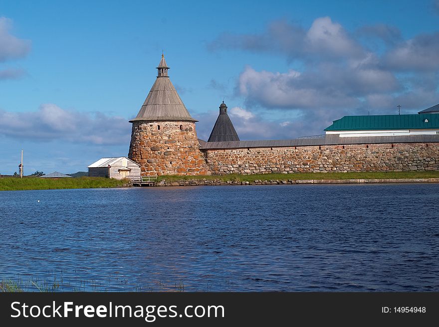 Old round stone tower in Solovetsky monastery with blue sky background, Karelia, Russian Federation. Old round stone tower in Solovetsky monastery with blue sky background, Karelia, Russian Federation.