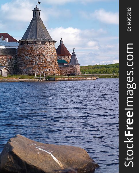 Old round stone tower in Solovetsky monastery with blue sky background, Karelia, Russian Federation. Old round stone tower in Solovetsky monastery with blue sky background, Karelia, Russian Federation.