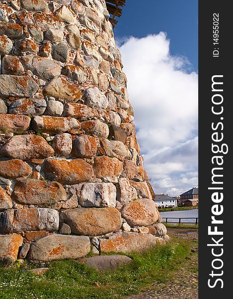 Old round stone tower in Solovetsky monastery with blue sky background, Karelia, Russian Federation. Old round stone tower in Solovetsky monastery with blue sky background, Karelia, Russian Federation.