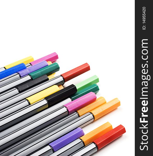 Colourful pens on a white background