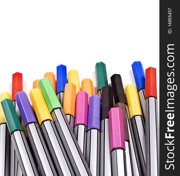 Colourful pens on a white background with space for text