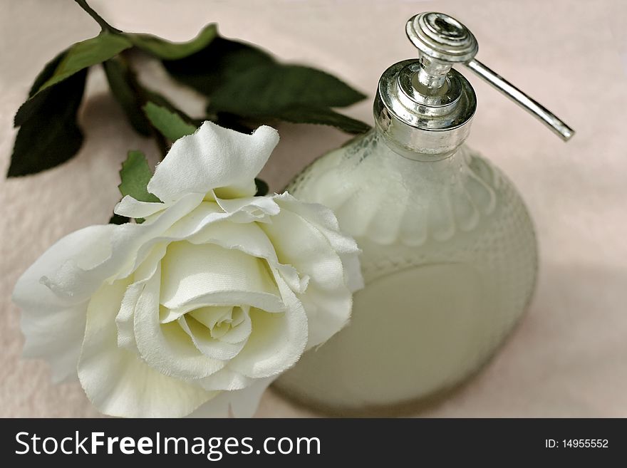 a background of soap and a silk rose. a background of soap and a silk rose