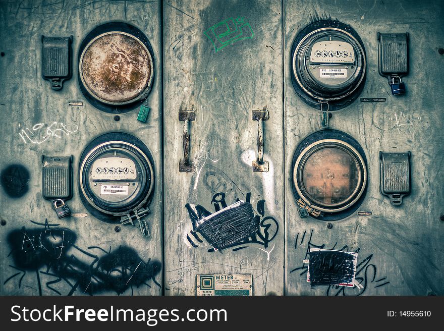 A grungey textured image of old electrical meters. A grungey textured image of old electrical meters
