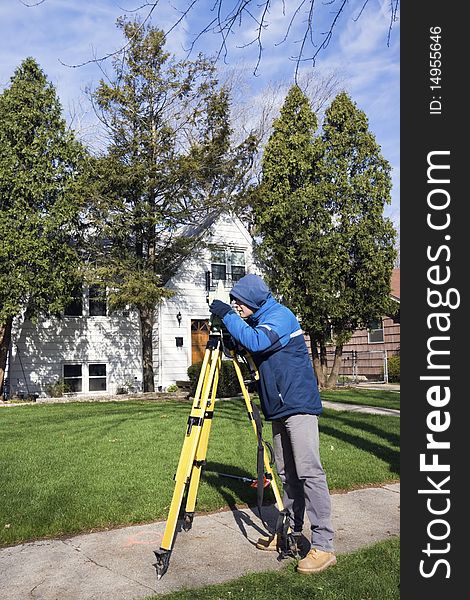 Surveyor Working With Theodolite