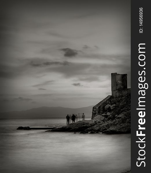 Long exposure with people talking on the sea