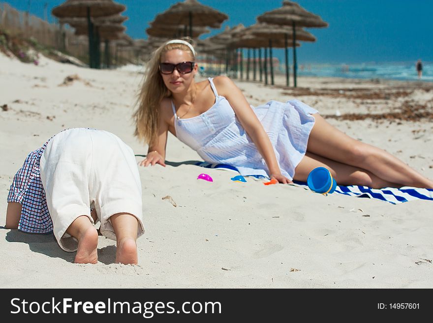 Child and mother on a beach. Child and mother on a beach