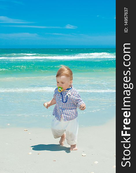 Child walking on a beach. Child walking on a beach