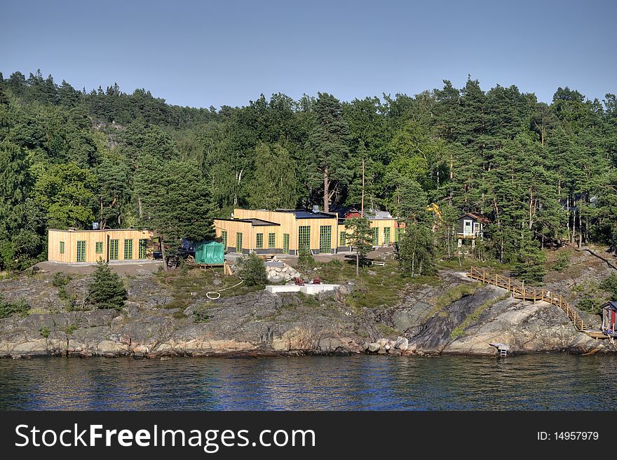 A new built wooden cabin on the waterfront in sweden. A new built wooden cabin on the waterfront in sweden