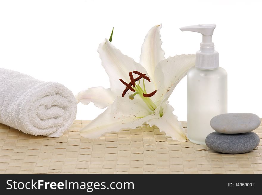 Madonna lily flower and spa stones with bottles. Madonna lily flower and spa stones with bottles