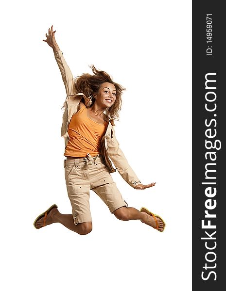 Happy young caucasian red-haired female jumping into the air