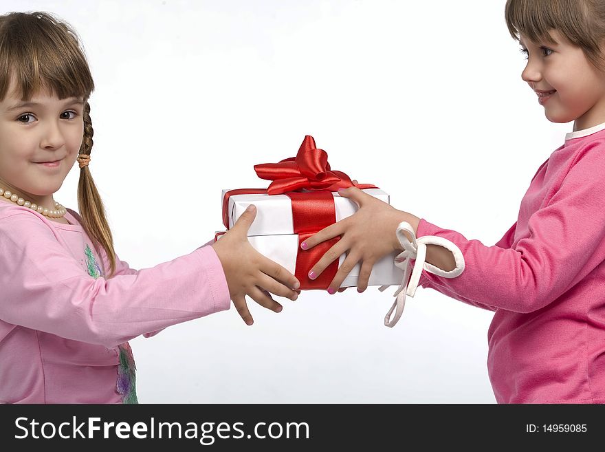 Two little girls holding white gift boxes. Two little girls holding white gift boxes