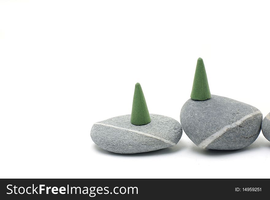 Green Incense cones on gray stones. Green Incense cones on gray stones