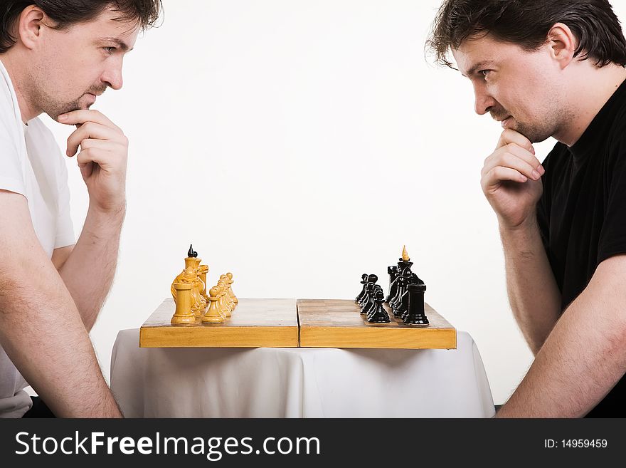 Two men play a chess