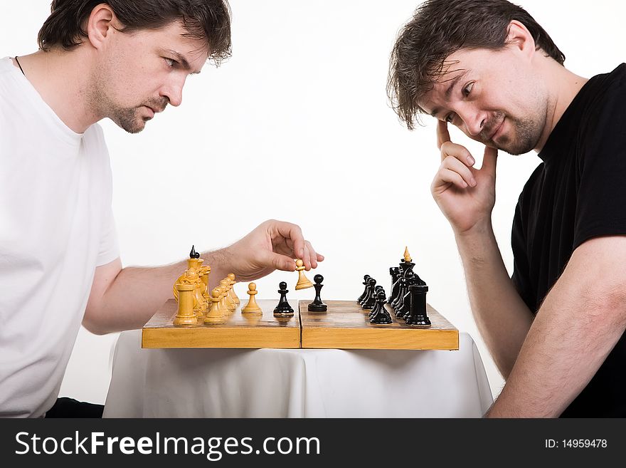 Chess players. Two men play a chess