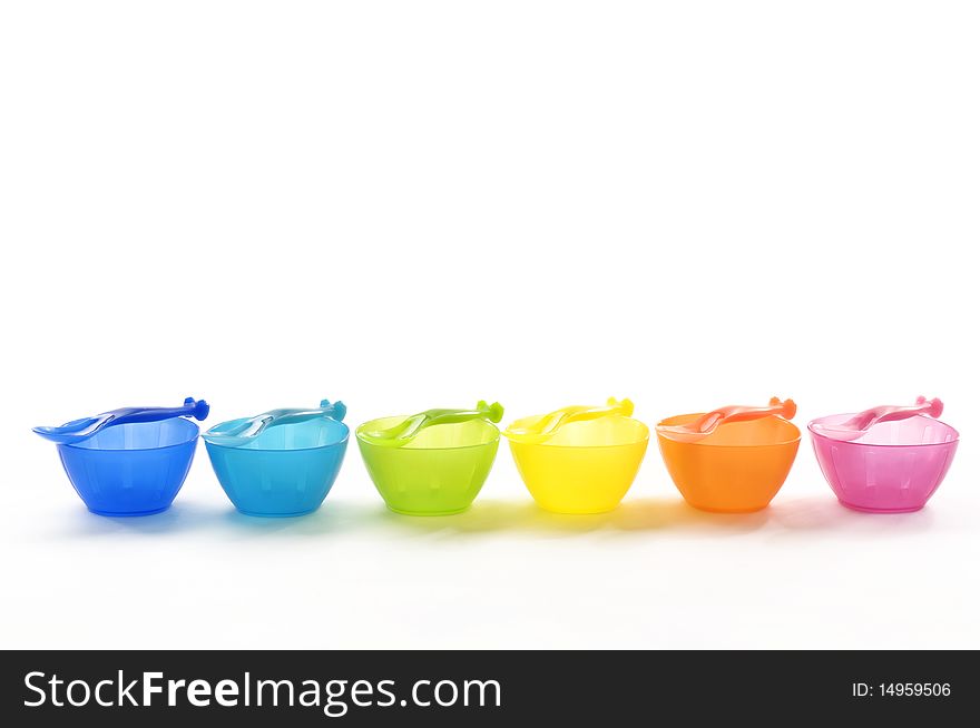 Color plastic dishes with forks. Color plastic dishes with forks