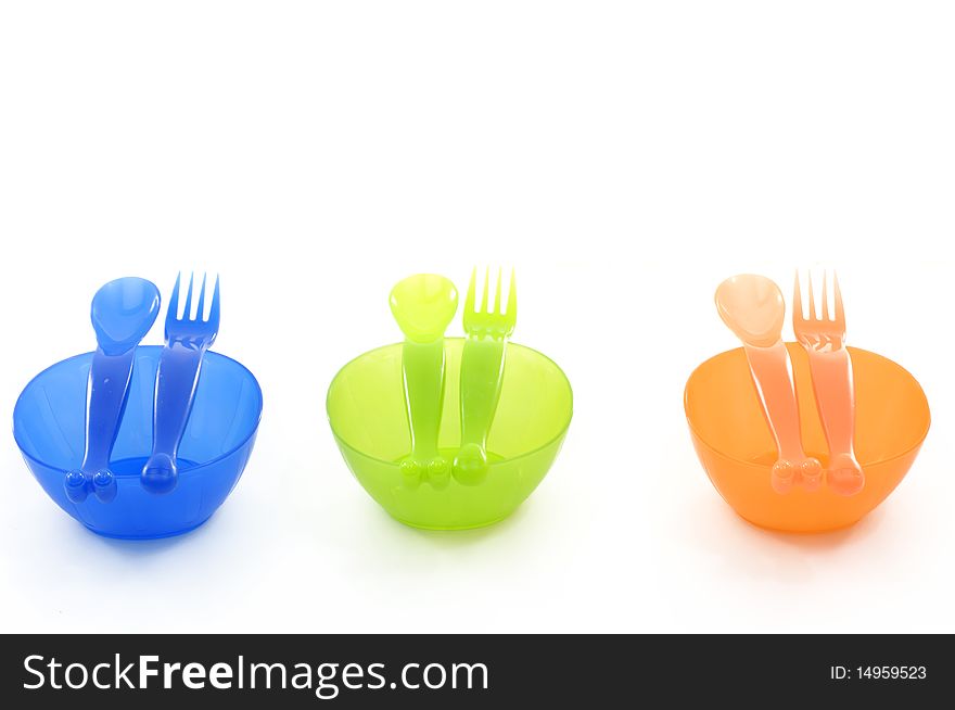 Color plastic dishes with forks. Color plastic dishes with forks
