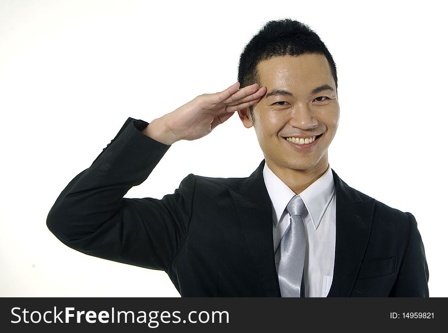 Asian young man by greeting gesture on white. Asian young man by greeting gesture on white