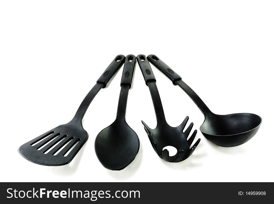 Kitchen set of plastic tools on a white background