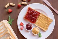Creamy Peanut Butter Toast And Strawberry Jam Toast On Plate With Nut And Fruit. Top View Stock Images