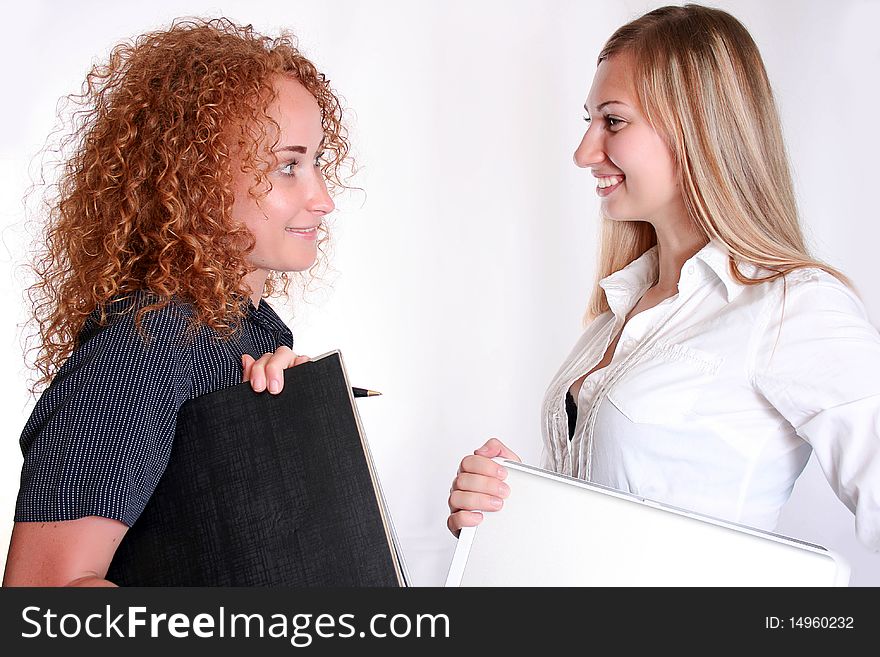 Young smiling business woman working  and consulting a partner. Young smiling business woman working  and consulting a partner