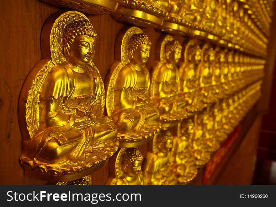 The image of Buddha sticks the wall. The image of Buddha sticks the wall